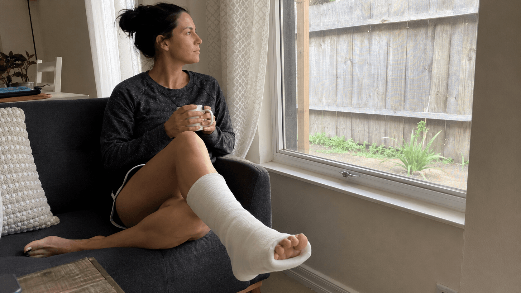 A person taking a slow, careful walk outdoors during ankle recovery
